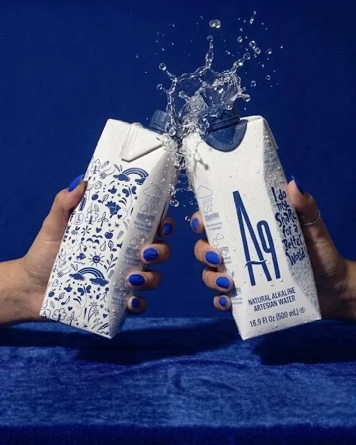 Two cold A9 cartons meeting in a splash of water