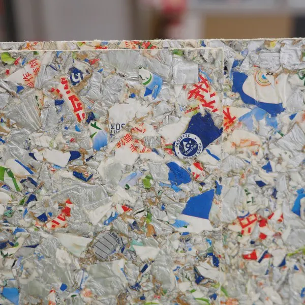 Close view of a building board made from recycled cartons